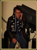 Richie Hayward on the phone with his wife Shauna wearing a death skull scarf. RIP dear friend., Little Feat on Nov 6, 2008 [593-small]