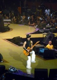 Prince ripping up a Fender in his super cool hat and furry white boots doing his thang, entertaining us like no other. What classic, we're missing his talent badly., Prince on Aug 14, 2004 [510-small]